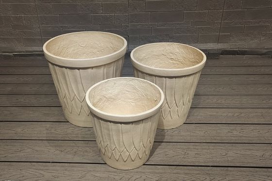 comprar Elegante plantador de fibra de argila com acabamento esculpido à mão online manufacture